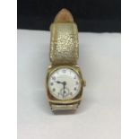 A VINTAGE 9 CARAT GOLD WRIST WATCH WITH ENGRAVING DATED 1939