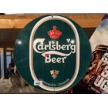 A TIN CARLSBERG BEER SIGN