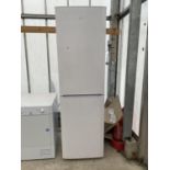 A LARGE WHITE BEKO UPRIGHT FRIDGE FREEZER BELIEVED IN WORKING ORDER BUT NO WARRANTY