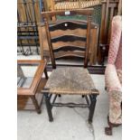 AN 18TH CENTURY ELM LADDERBACK CHAIR