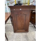 A GEORGE III MAHOGANY CORNER CUPBOARD