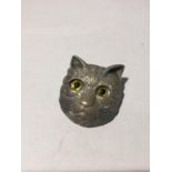 A CAT BROOCH WITH GLASS EYES