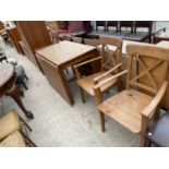 A MODERN PINE DROP LEAF DINING TABLE AND THREE CHAIRS