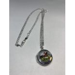 A SILVER CHAIN AND LOCKET WITH AN ENAMEL RACE HORSE AND RIDER DESIGN