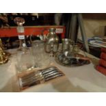 AN ASSORTMENT OF WHITE METAL ITEMS TO INCLUDE A CAKE STAND AND A SHIP THEMED DECANTER