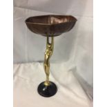 AN ART DECO COPPER DISH ON A BRASS FIGURINE