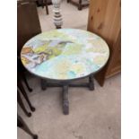 AN OCCASIONAL TABLE, THE TOP DECORATED WITH WORLD AND UK MAPS