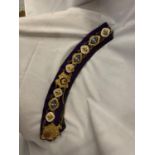 A MASONIC ORNATE COLLAR WITH BADGES ON A CHAIN