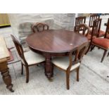 A CIRCULAR VICTORIAN STYLE DINING TABLE, 47" DIAMETER, ON TURNED AND FLUTED LEGS AND FOUR SIMILAR