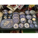 A LARGE SELECTION OF BLUE AND WHITE CERAMICS MAINLY OF CHINESE STYLE TO INCLUDE PLATES , CHARGER