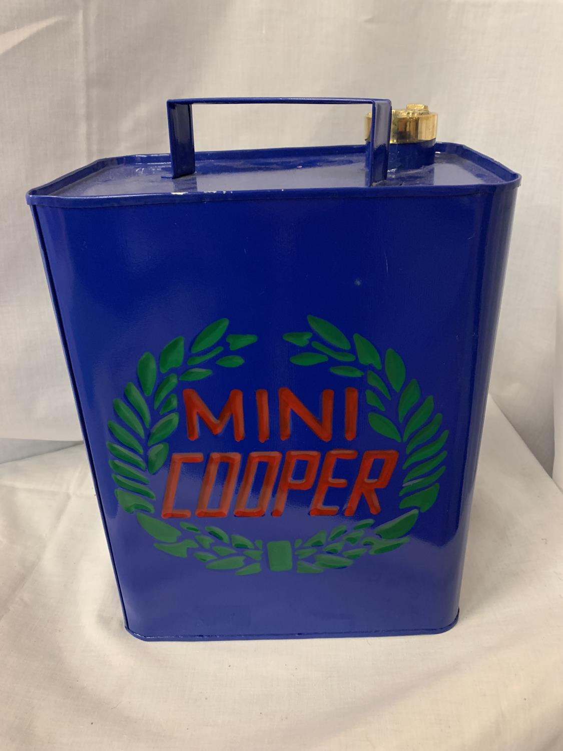 A BLUE MINI COOPER PETROL CAN WITH BRASS STOPPER