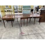 A 19TH CENTURY MAHOGANY EXTENDING DROP-LEAF DINING TABLE WITH DETACHABLE D-ENDS ON TURNED LEGS,