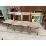 A COLLECTION OF FOUR WOODEN FOLDING CHAIRS