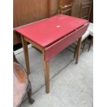 A 1950'S KITCHEN DROP-LEAF TABLE WITH RED FORMICA TOP