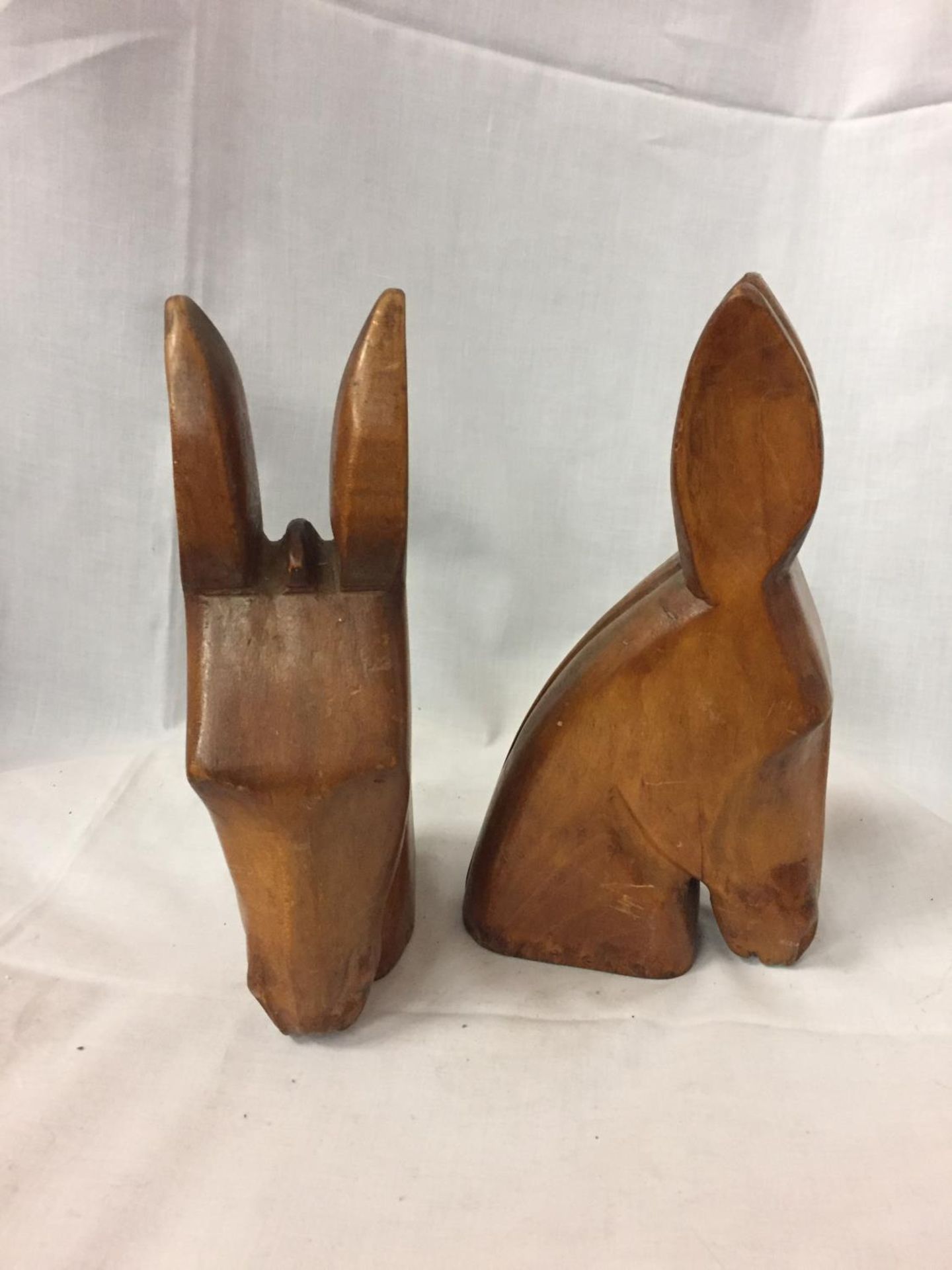 A PAIR OF TREN CARVED BOOKENDS