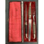 A HORN HANDLED THREE PIECE CARVING SET IN PRESENTATION CASE