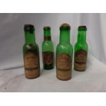 A COLLECTION OF 4 VINTAGE GREEN GLASS HERB BOTTLES