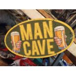 A METAL SIGN "MAN CAVE"