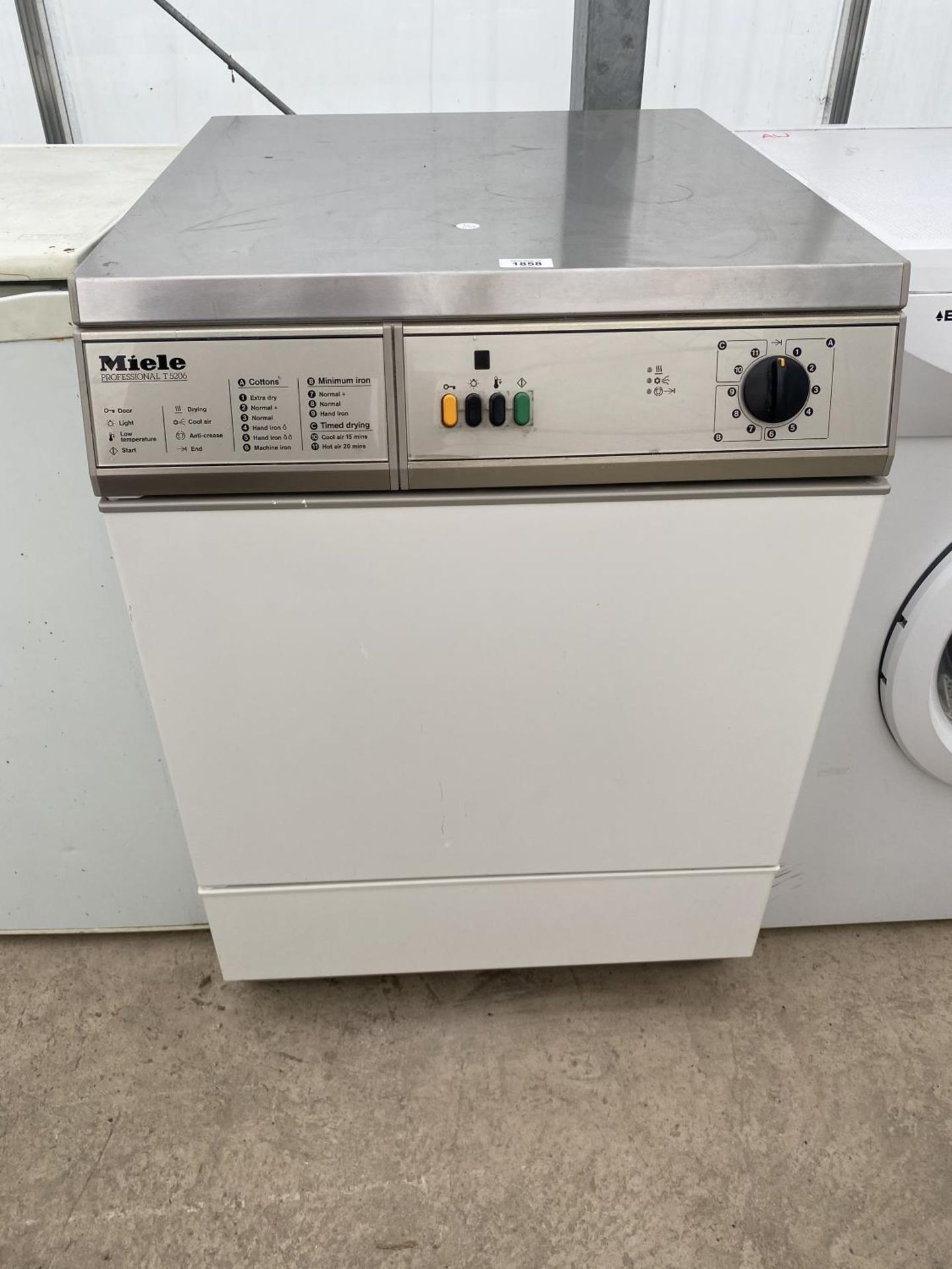 A MIELE PROFESSIONAL T5206 CONDENSOR DRYER BELIEVED IN WORKING ORDER BUT NO WARRANTY