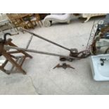 A VINTAGE GARDEN SEED DRILL
