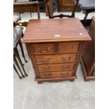 A REPRODUCTION MINIATURE CHEST OF DRAWERS, 19.5" WIDE