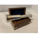 A CHROME TELESCOPE IN WOODEN HINGED BOX WITH BRASS DETAILING