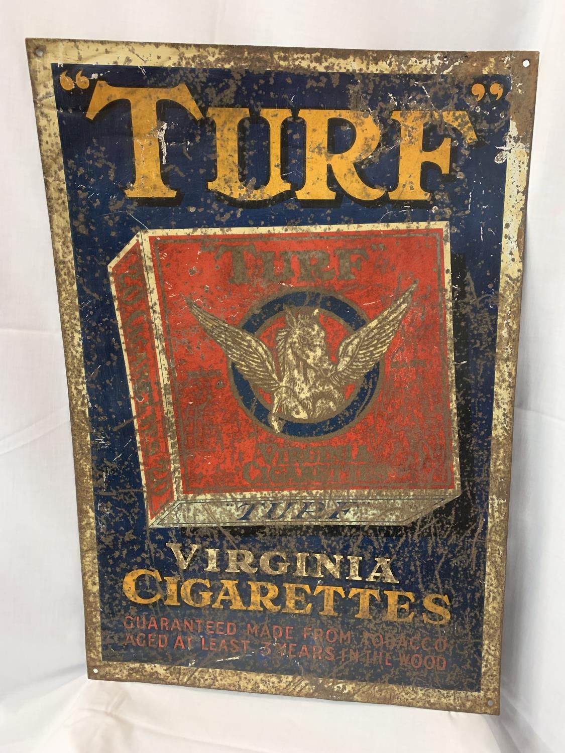 A 1920'S TIN TURF SIGN 74CM X 51CM