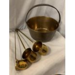 A BRASS JAM PAN AND THREE BRASS LADLES