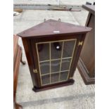 A MAHOGANY CORNER CABINET