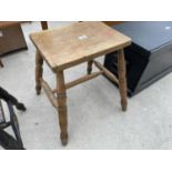 A VICTORIAN BEECH STOOL ON FOUR TURNED LEGS