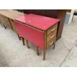 AN UNUSUAL 1950'S GATE-LEAF KITCHEN TABLE ENCLOSING THREE DRAWERS AND CUPBOARD, 31.5X47"
