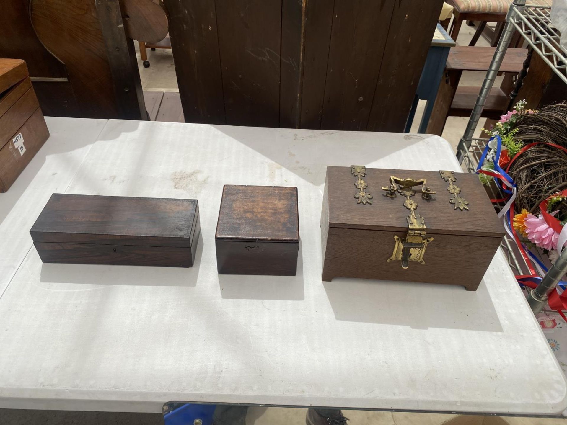 A GROUP OF THREE VARIOUS DECORATIVE TREEN BOXES