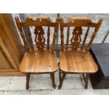 A PAIR OF MODERN PINE KITCHEN CHAIRS