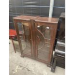 AN ART DECO TWO DOOR DISPLAY CABINET