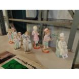 A COLLECTION OF FOUR CHILD FIGURINES