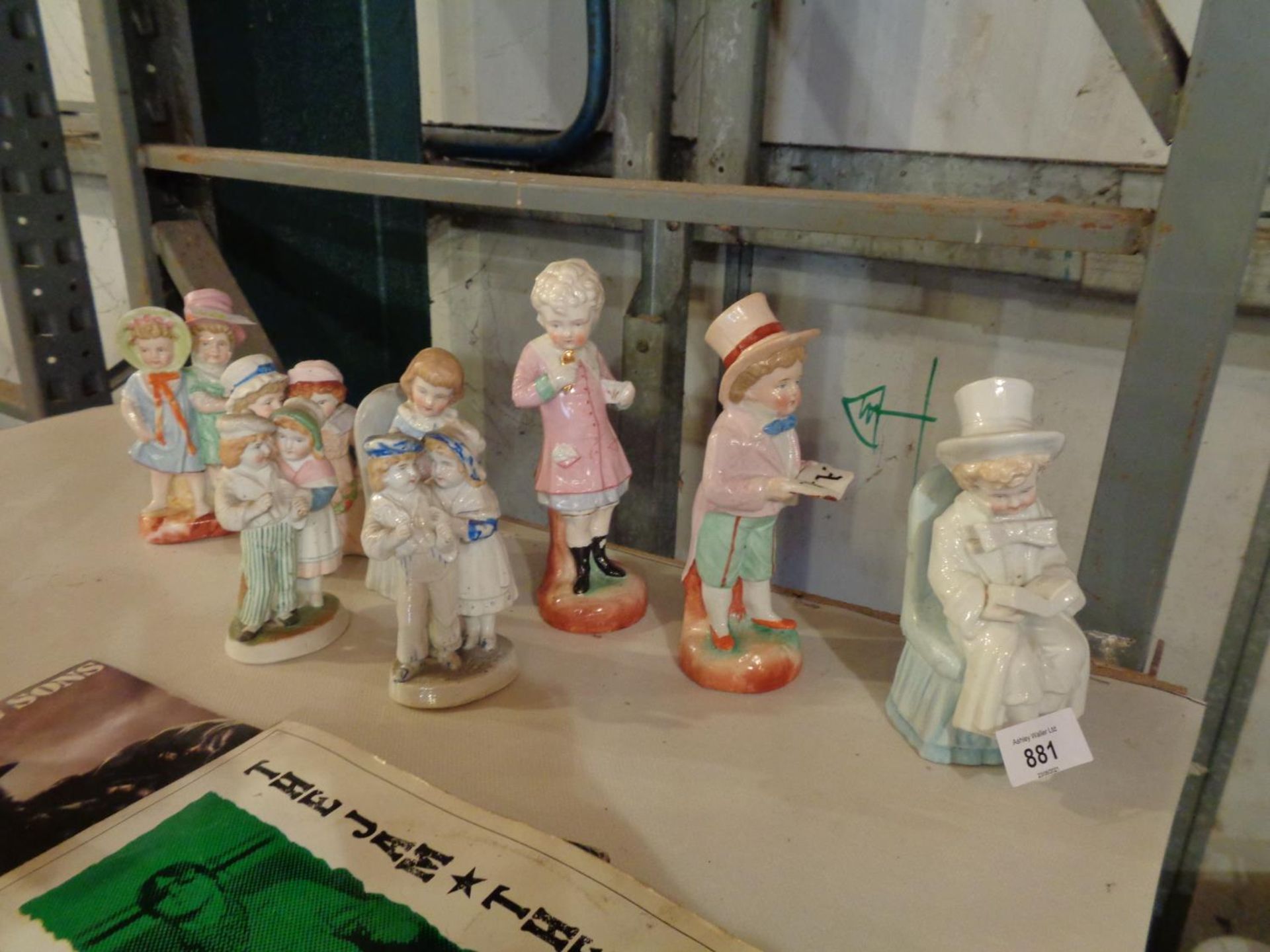 A COLLECTION OF FOUR CHILD FIGURINES