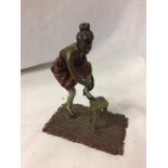A BERGMAN STYLE COLD PAINTED FIGURINE OF A LADY WITH HER FOOT ON A STOOL HEIGHT APPROXIMATELY 12CM