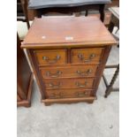 A REPRODUCTION MINIATURE CHEST OF DRAWERS, 19.5" WIDE