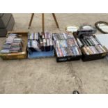 A LARGE QUANTITY OF DVDS AND CDS