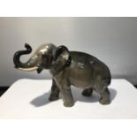 A ROYAL DOULTON FIGURINE OF A GREY ELEPHANT