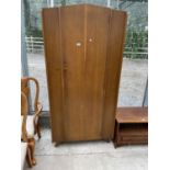 A 20TH CENTURY OAK SINGLE DOOR WARDROBE