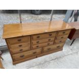 A YOUNGER FURNITURE PINE CHEST OF NINE VARIOUS SIZED DRAWERS, 56.5" WIDE