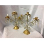 A SET OF TWO MATCHING GILT CANDLE HOLDERS WITH CRYSTAL DECORATION