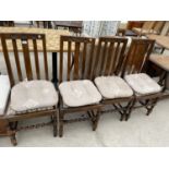 A SET OF FOUR EARLY 20TH CENTURY OAK DINING CHAIRS ON BARLEYTWIST LEGS