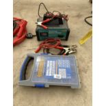 A BATTERY CHARGER, EXTENSION LEADS AND A SCREW BOX