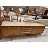 A RETRO TEAK YOUNGER SIDEBOARD, 84" WIDE, ENCLOSING FOUR DRAWERS AND FOUR CUPBOARDS