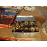 A COLLECTION OF ITEMS TO INCLUDE WATCHES AND SPARES, BRASS BELL ETC IN A TIN