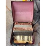 A VINTAGE PAULO ANTONIO ACCORDIAN IN A LEATHER CARRYING CASE