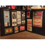 AN ALBUM CONTAINING VARIOUS VINTAGE MATCHBOX CARDS