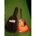 AN ENCOURE ENC165EAR ACCOUSTIC GUITAR WITH CASE AND MUSIC BOOK